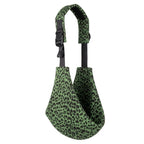 Green leopard print baby carrier sling with adjustable strap on white background