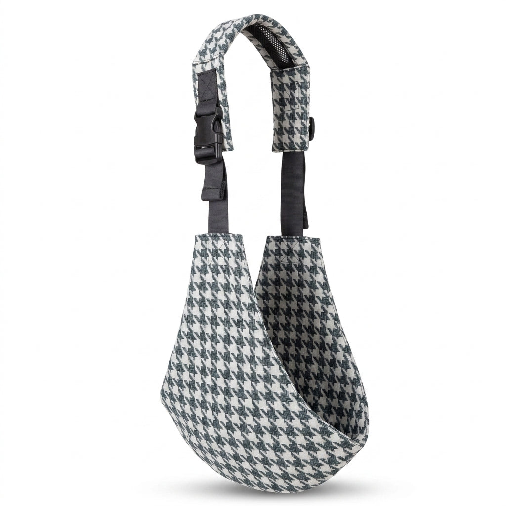 Houndstooth patterned baby carrier sling with adjustable shoulder strap on white background